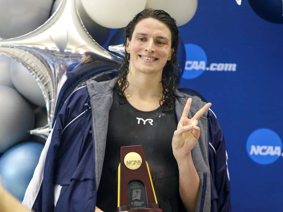 Lia Thomas holds her trophy after winning the 500 yard freestyle at the NCAA women’s swimming championship on 17 March 2022 (Brett Davis/USA TODAY Sports)