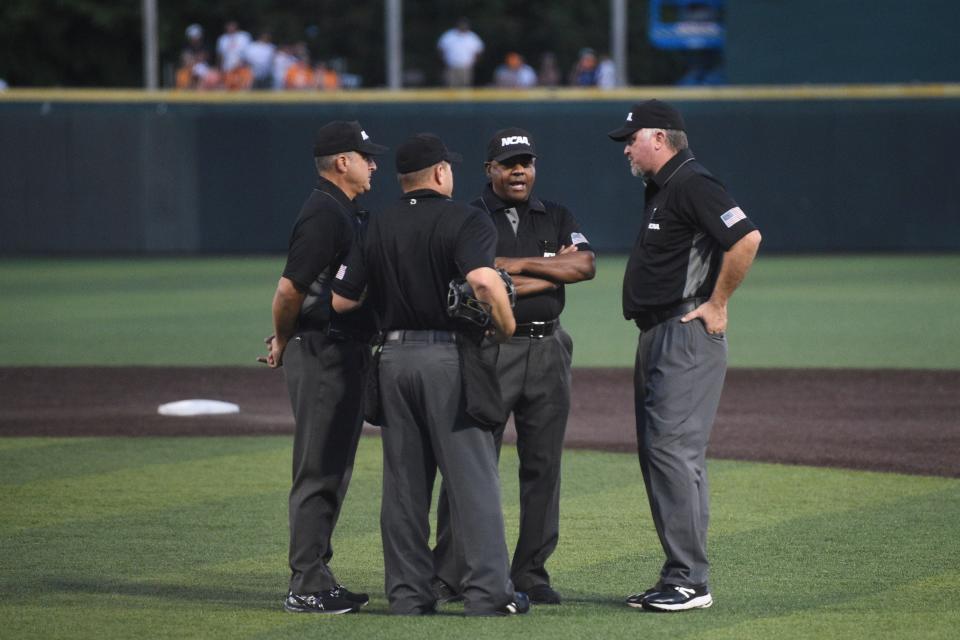 Officials discuss on the field during the NCAA Baseball Tournament Knoxville Regional between the Tennessee Volunteers and Campbell Fighting Camels held at Lindsey Nelson Stadium on Saturday, June 4, 2022. 