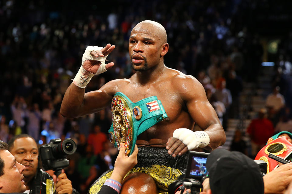 LAS VEGAS, NV - MAY 04: Floyd Mayweather Jr. celebrates his unanimous-decision victory over Robert Guerrero in their WBC welterweight title bout at the MGM Grand Garden Arena on May 4, 2013 in Las Vegas, Nevada. (Photo by Al Bello/Getty Images)