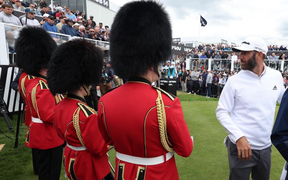 Dustin Johnson and some Beefeaters on the first tee - ACTION IMAGES