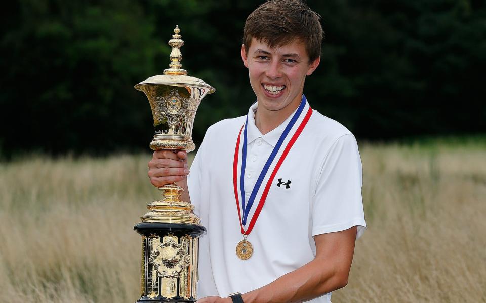 Matt Fitzpatrick of England stands with the Havemeyer trophy after winning the 2013 U.S. Amateur Championship at The Country Club on August 18, 2013 in Brookline, Massachusetts. - GETTY IMAGES