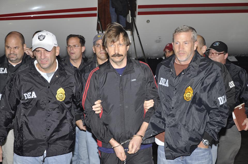 WHITE PLAINS, NY - NOVEMBER 16: In this photo provided by the U.S. Department of Justice, former Soviet military officer and arms trafficking suspect Viktor Bout (C) deplanes after arriving at Westchester County Airport November 16, 2010 in White Plains, New York. Bout was extradited from Thailand to the U.S. to face terrorism charges after a final effort by Russian diplomats to have him released failed. (Photo by U.S. Department of Justice via Getty Images)