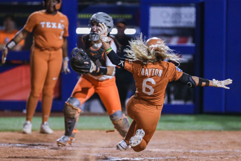 UT outfielder Bella Dayton (6) runs home as the Oklahoma State Cowgirls face the Texas Longhorns in the second game of the 2022 Women's College World Series semifinal at USA Softball Hall of Fame Complex in Oklahoma City on Monday, June 6, 2022.