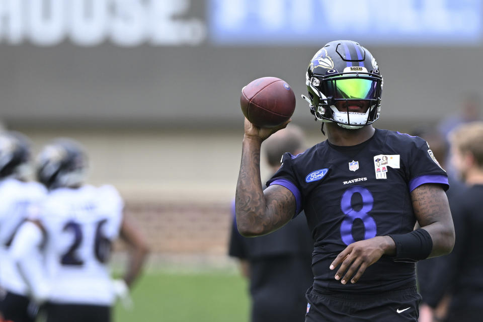 Baltimore Ravens quarterback Lamar Jackson takes part in drills at the NFL football team's practice facility, Tuesday, June 14, 2022, in Owings Mills, Md. (AP Photo/Gail Burton)