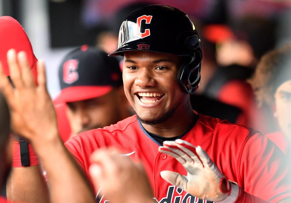 Jun 11, 2022; Cleveland, Ohio, USA; Cleveland Guardians right fielder Oscar Gonzalez (39) celebrates after scoring during the fourth inning against the Oakland Athletics at Progressive Field. Mandatory Credit: Ken Blaze-USA TODAY Sports