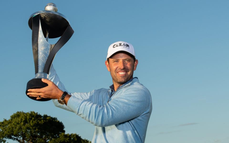 Charl Schwartzel of South Africa of the Stinger GC team poses for a trophy after winning the Individual Trophy for the final round of the Inaugural LIV Golf Invitational at The Centurion Club on June 11, 2022 in St Albans, England - GETTY IMAGES