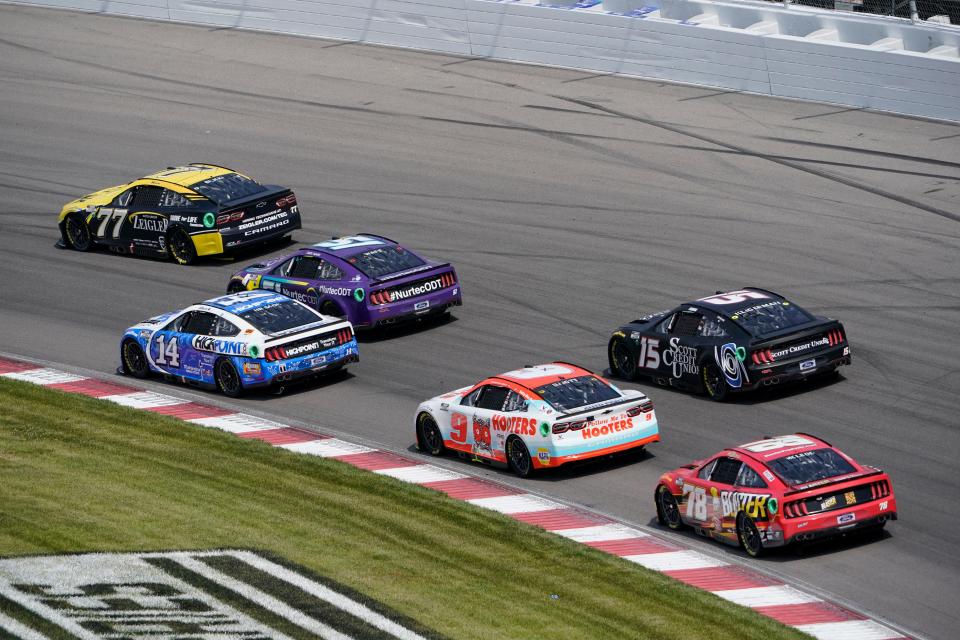 Drivers enter Turn 2 during a NASCAR Cup Series auto race at World Wide Technology Raceway, Sunday, June 5, 2022, in Madison, Ill. (AP Photo/Jeff Roberson)