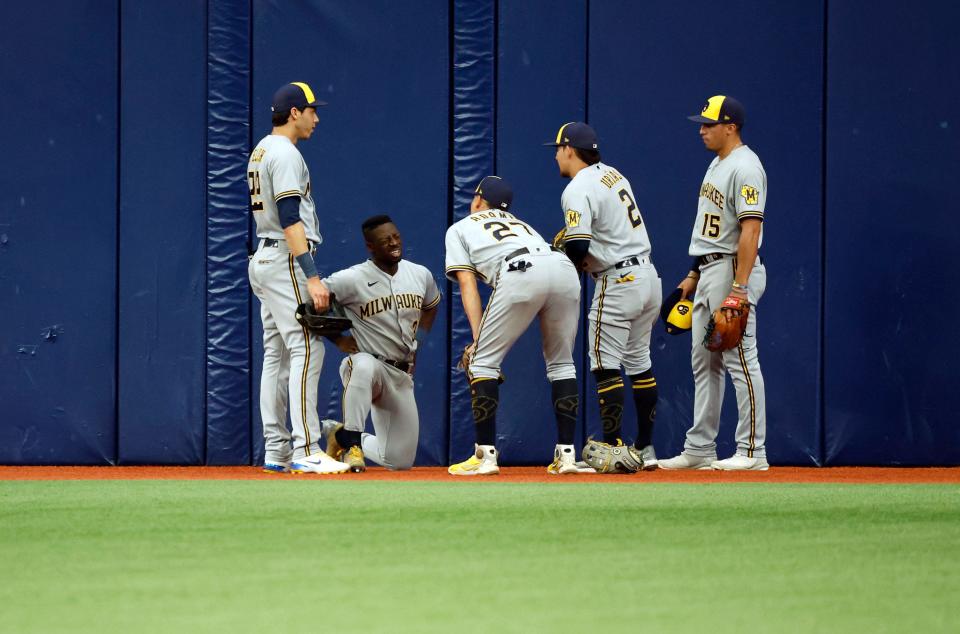 Milwaukee Brewers centerfielder Jonathan Davis (3) reacts after making an incredible catch during the second inning against the Tampa Bay Rays Wednesday at Tropicana Field.