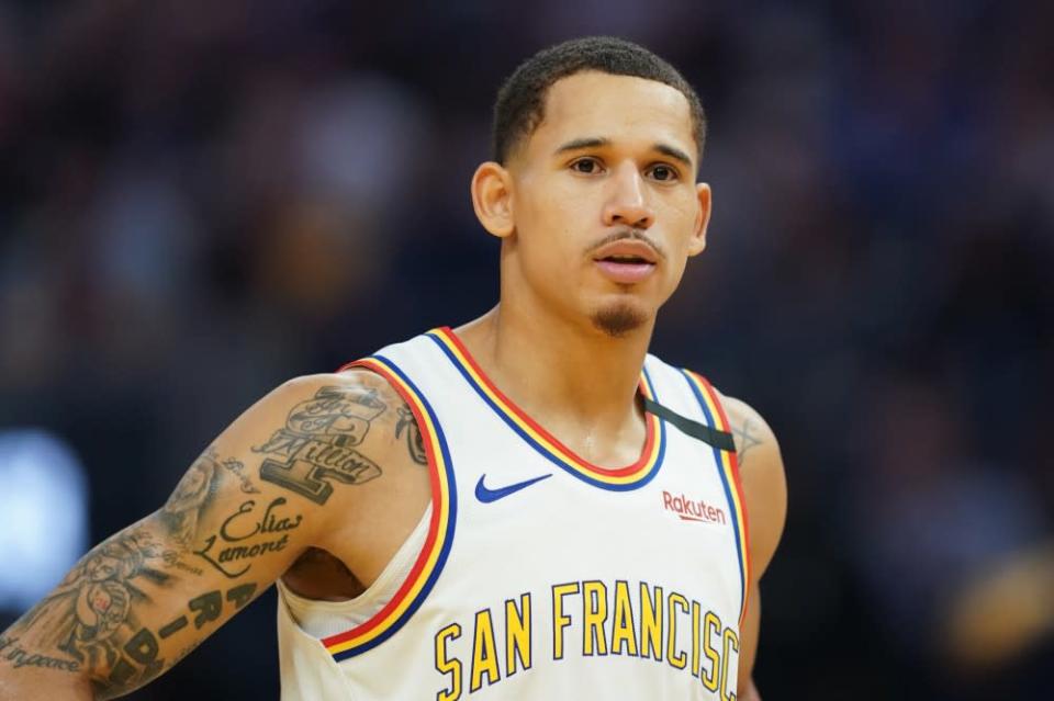 Feb 20, 2020; San Francisco, California, USA; Golden State Warriors forward Juan Toscano-Anderson (95) stands on the court before the start of the second quarter against the Houston Rockets at Chase Center.