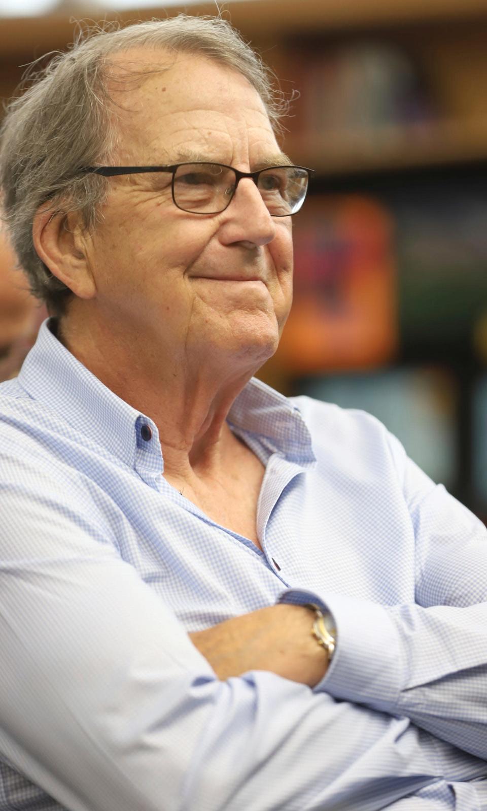 Former Michigan football coach Lloyd Carr smiles after his grandson, Saline QB C.J. Carr, announces his commitment to Notre Dame at Liberty School in Saline on Thursday, June 9, 2022.