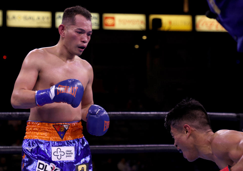 CARSON, CALIFORNIA - DECEMBER 11: Nonito Donaire watches as Reymart Gaballo reacts to a body shot resulting in a third round knockout win for the WBC World Bantamweight Championship at Dignity Health Sports Park on December 11, 2021 in Carson, California. (Photo by Harry How/Getty Images)