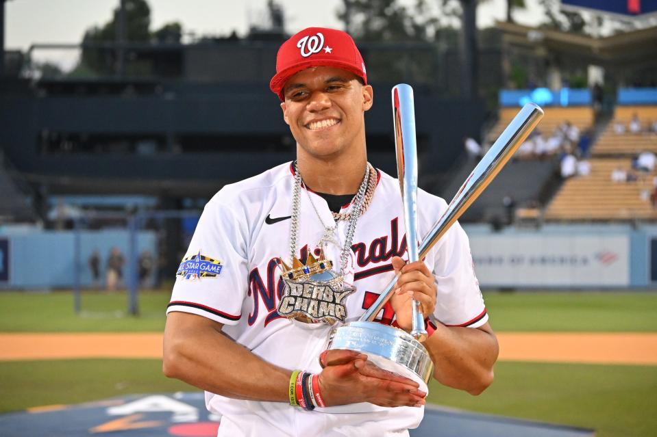 Juan Soto celebrates his win with the trophy and derby champion chain.