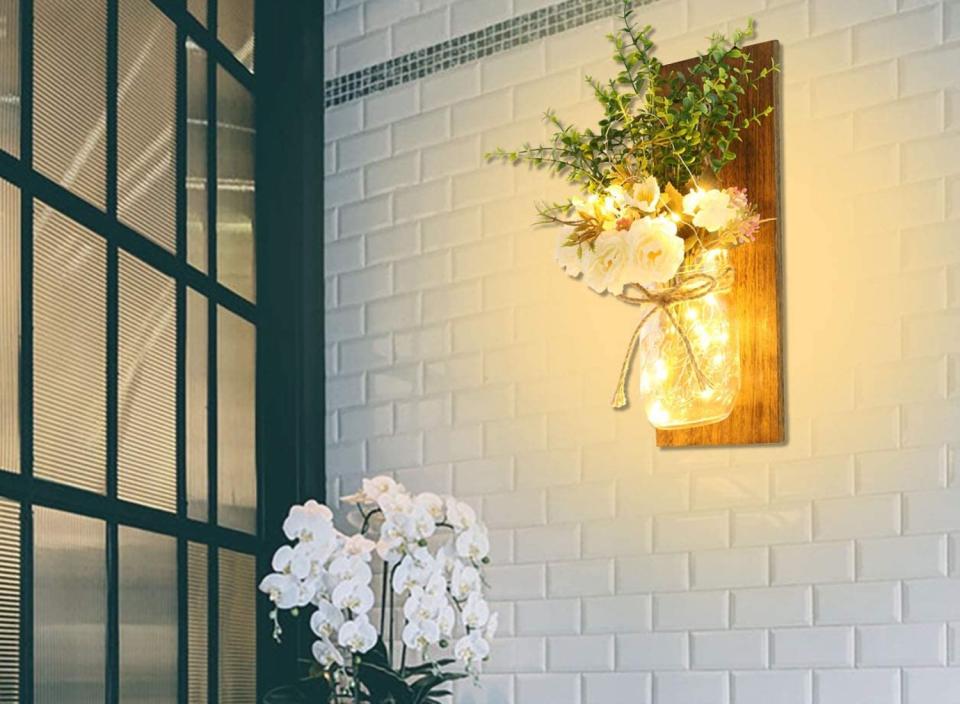 Add a pair of mason jar sconces to brighten up your space. (Source: Amazon)