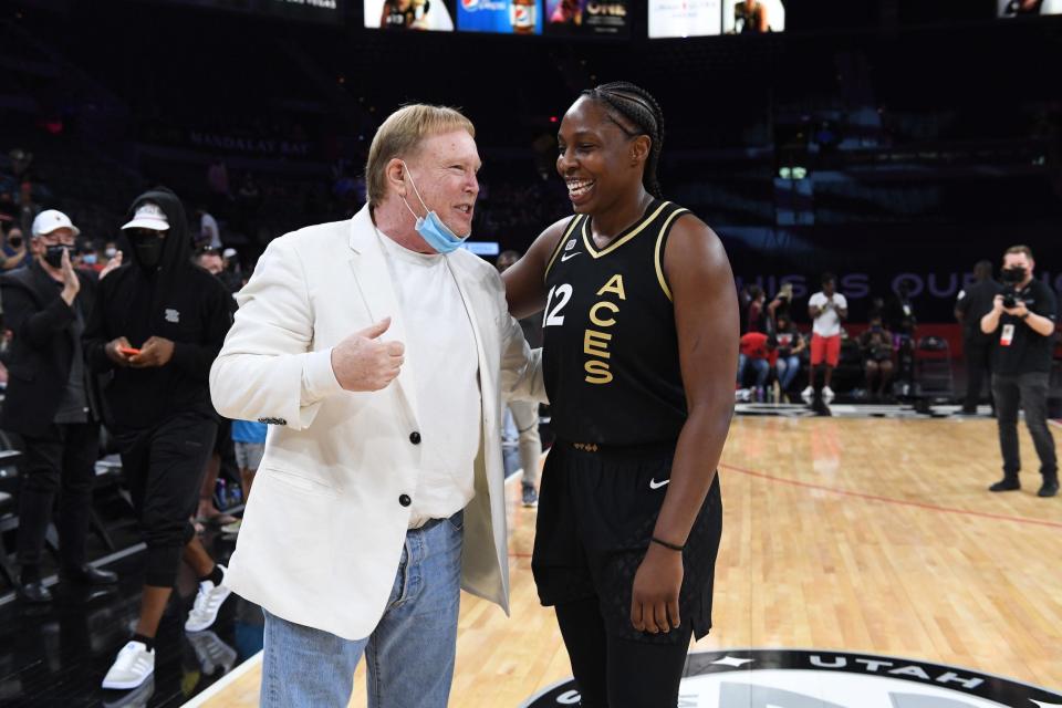 Aces owner Mark Davis (left) chats with point guard Chelsea Gray.