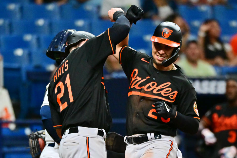 ST PETERSBURG, FLORIDA - JULY 15: Ramon Urias #29 of the Baltimore Orioles celebrates with Austin Hays #21 after hitting a two-run home run in the eighth inning against the Tampa Bay Rays at Tropicana Field on July 15, 2022 in St Petersburg, Florida. (Photo by Julio Aguilar/Getty Images)