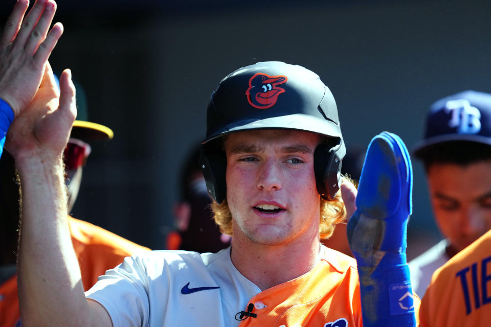 LOS ANGELES, CA - JULY 16: Gunnar Henderson #2 of the Baltimore Orioles is congratulated in the dugout after scoring a run in in the first inning during the 2022 SiriusXM All-Star Futures Game at Dodger Stadium on Saturday, July 16, 2022 in Los Angeles, California. (Photo by Daniel Shirey/MLB Photos via Getty Images)