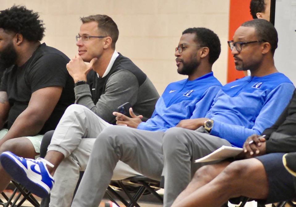 Duke men’s basketball head coach Jon Scheyer, left, assistant coach Jai Lucas and associate head coach Chris Carrawell, right, watch potential recruits play during the Nike Elite Youth Basketball League (EYBL) Peach Jam event in North Augusta, S.C. on Friday, July 22.