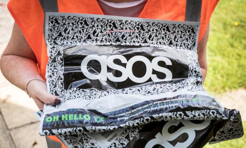 A woman delivering a package from Asos