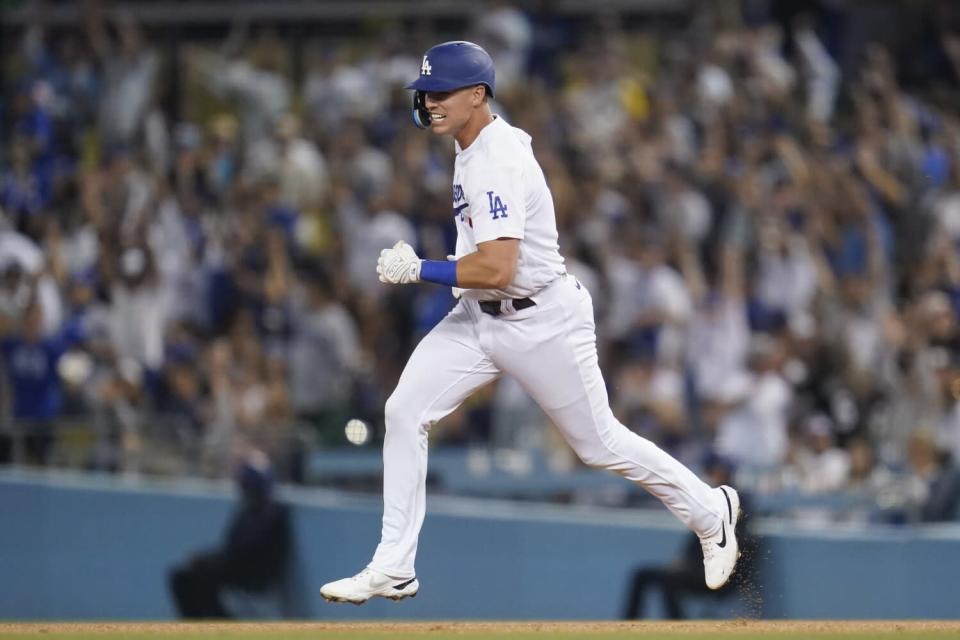 The Dodgers' Jake Lamb rounds the bases after hitting a tying home run during the seventh inning July 9, 2022.