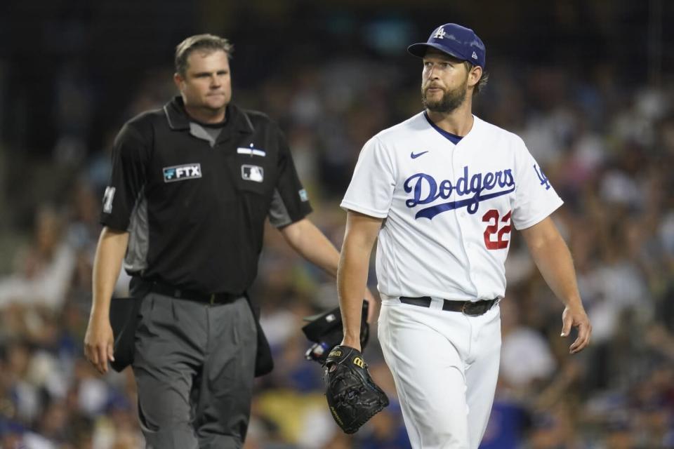 Dodgers pitcher Clayton Kershaw returns to the dugout after the seventh inning.