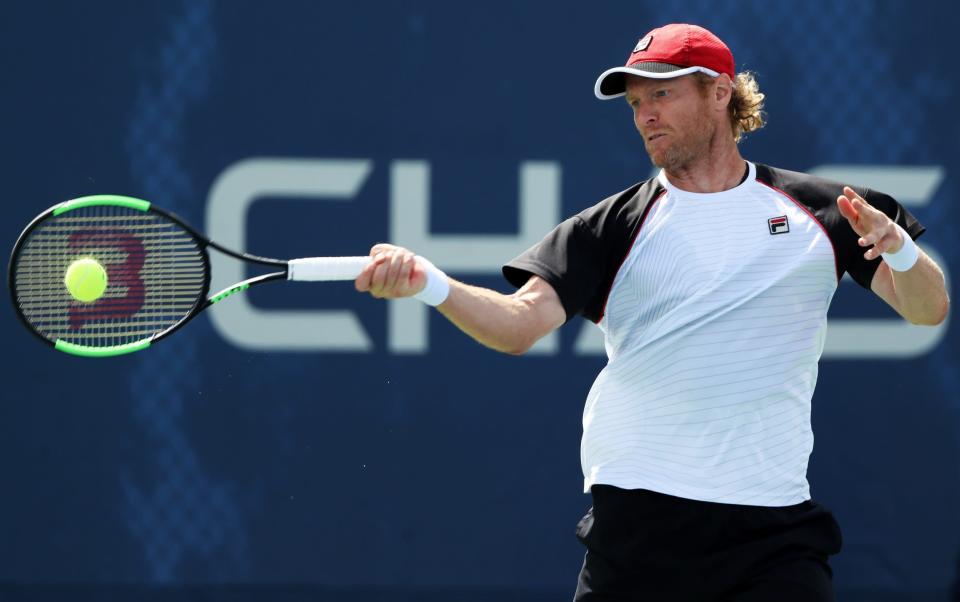 Dmitry Tursunov of Russia returns a shot during his first round Men's Singles match against Cameron Norrie of the United Kingdom on Day One of the 2017 US Open at the USTA Billie Jean King National Tennis Center on August 28, 2017 in the Flushing neighborhood of the Queens borough of New York City - GETTY IMAGES