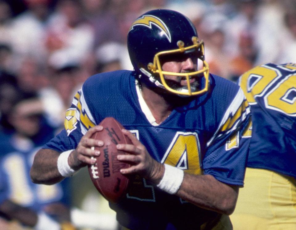 Jan 16, 1983; Miami, FL, USA; FILE PHOTO; San Diego Chargers quarterback Dan Fouts (14) in action against the Miami Dolphins during the 1982 AFC Divisional Playoff Game at the Orange Bowl. The Dolphins defeated the Chargers 34-13. Mandatory Credit: Malcolm Emmons-USA TODAY Sports