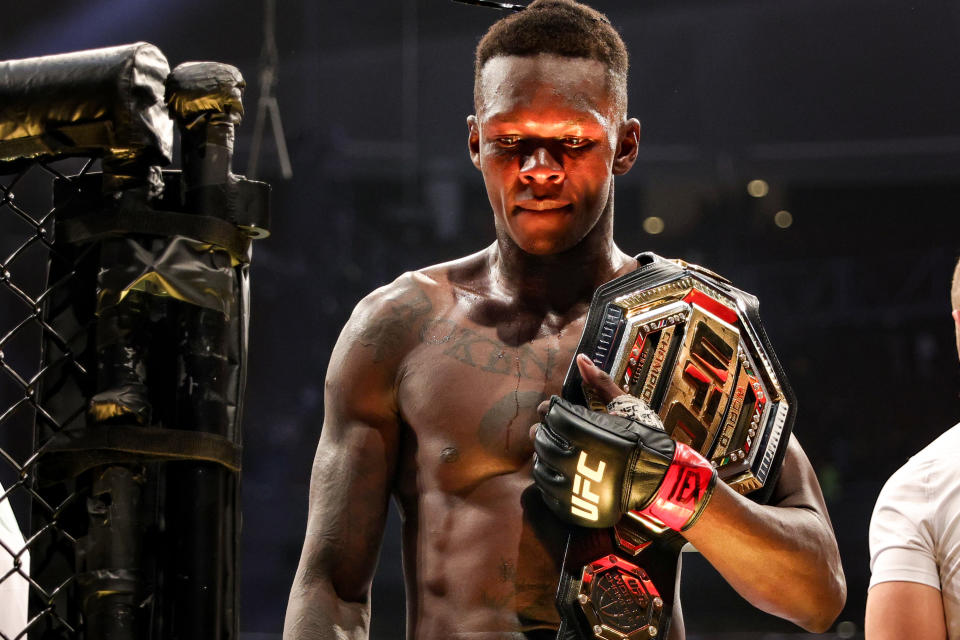 HOUSTON, TEXAS - FEBRUARY 12: Israel Adesanya of Nigeria celebrates after defending his middleweight championship against Robert Whittaker of Australia during UFC 271 at Toyota Center on February 12, 2022 in Houston, Texas. (Photo by Carmen Mandato/Getty Images)