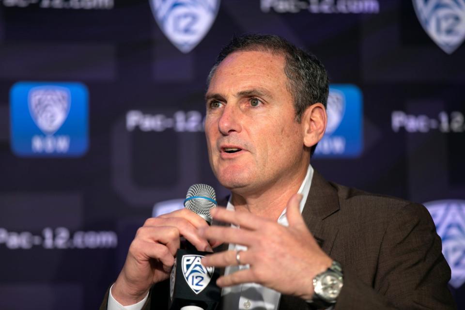 FILE - In this Oct. 7, 2019, file photo, Pac-12 Commissioner Larry Scott speaks to reporters during the Pac-12 Conference women's NCAA college basketball media day in San Francisco. Scott is stepping down at the end of June 2021, ending an 11-year tenure in which the conference landed a transformational billion dollar television deal but struggled to keep up with some of its Power Five peers when it came to revenue and exposure. (AP Photo/D. Ross Cameron, File)