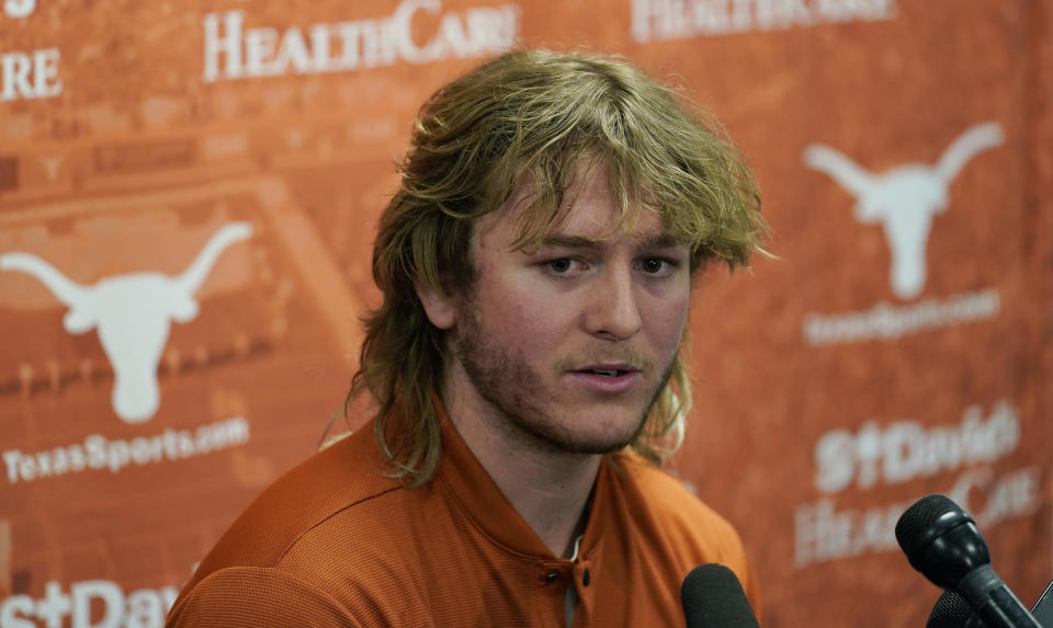 Texas NCAA college football quarterback Quinn Ewers talks to the media following a spring practice, Thursday, April 14, 2022, in Austin, Texas. (AP Photo/Eric Gay)