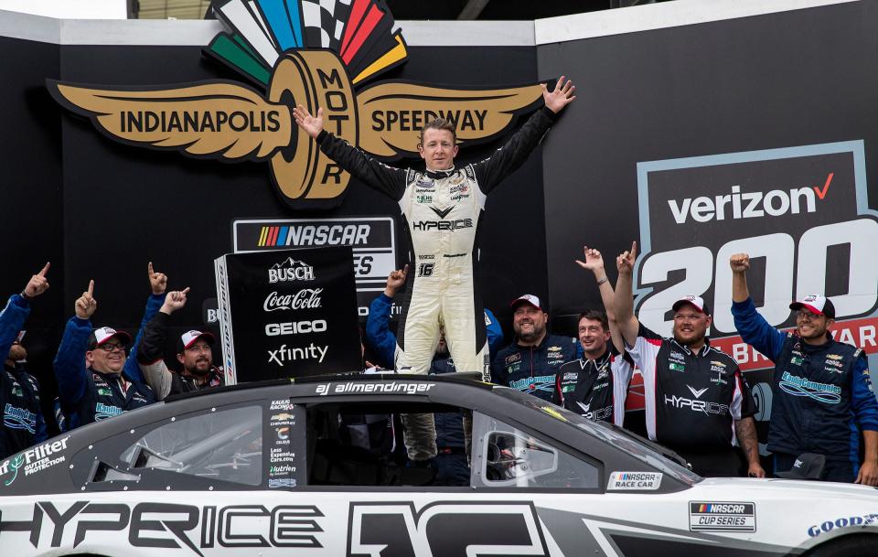 AJ Allmendinger (16) celebrates after winning the 2021 Verizon 200 at the Brickyard.