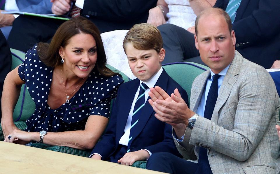 Britain's Catherine, the Duchess of Cambridge and Britain's Prince William, Duke of Cambridge and their son Prince George in the royal box ahead of the men's singles final between Serbia's Novak Djokovic and Australia's Nick Kyrgios - REUTERS