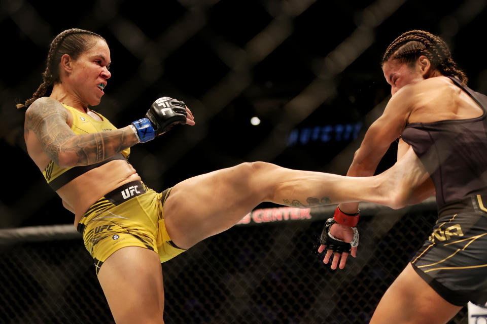 DALLAS, TEXAS - JULY 30: Amanda Nunes (L) of Brazil kicks Julianna Pena in their bantamweight title bout during UFC 277 at American Airlines Center on July 30, 2022 in Dallas, Texas. (Photo by Carmen Mandato/Getty Images)