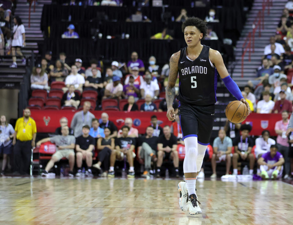 LAS VEGAS, NEVADA - JULY 09: Paolo Banchero #5 of the Orlando Magic brings the ball up the court against the Sacramento Kings during the 2022 NBA Summer League at the Thomas &amp; Mack Center on July 09, 2022 in Las Vegas, Nevada. NOTE TO USER: User expressly acknowledges and agrees that, by downloading and or using this photograph, User is consenting to the terms and conditions of the Getty Images License Agreement. (Photo by Ethan Miller/Getty Images)