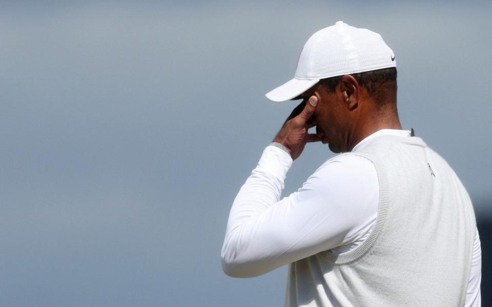 Tiger Woods of the U.S. reacts on the 18th during the second round - Reuters