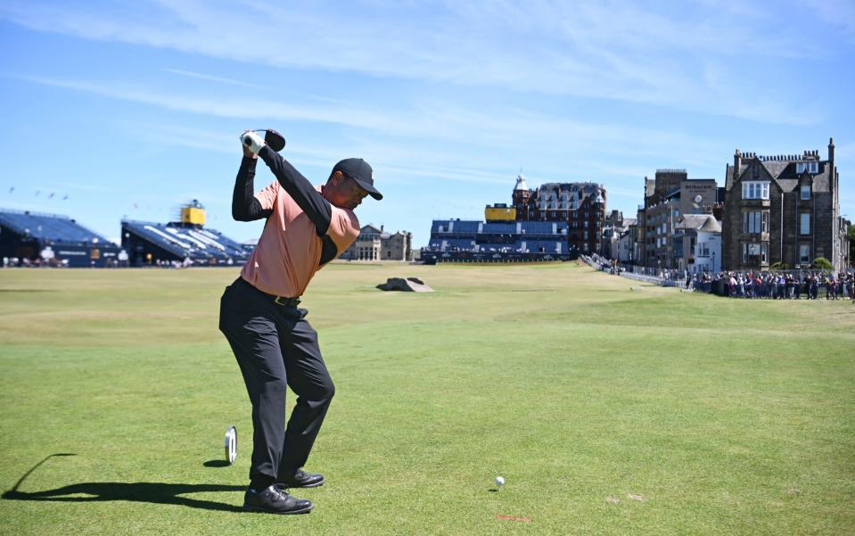 Spectators lined the famous fairway as Tiger Woods drove the famous 18th green at St Andrews - GETTY IMAGES