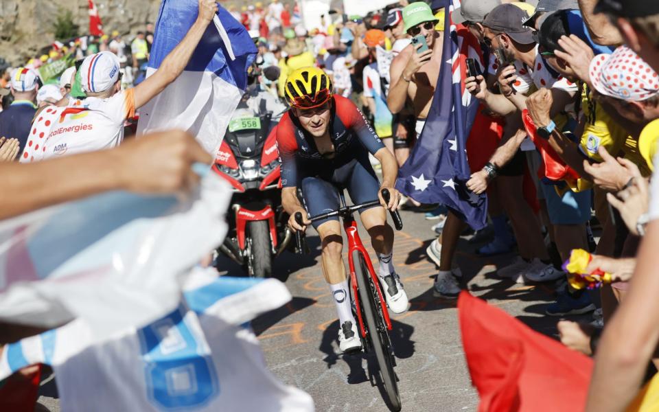 Tom Pidcock powers through the crowds on Alpe d'Huez - EPA-EFE/SHUTTERSTOCK