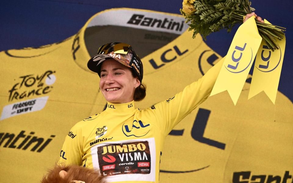 Team Jumbo Visma's Dutch rider Marianne Vos celebrates her overall leader yellow jersey on the podium at the end of the 2nd stage of the new edition of the Women's Tour de France cycling race, 136,4 km between Meaux and Provins - JEFF PACHOUD/AFP via Getty Images