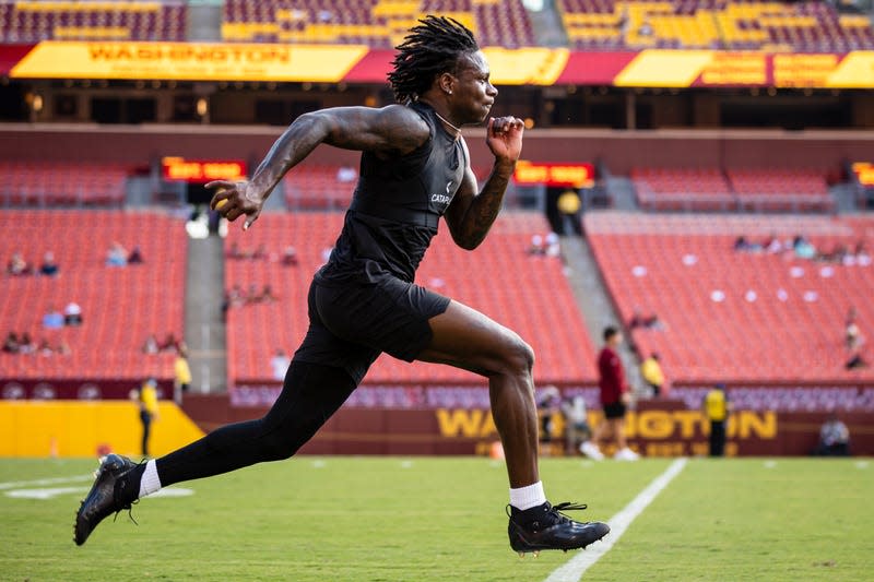 Marquise Brown #5 of the Baltimore Ravens warms up before the preseason game against the Washington Football Team at FedExField on August 28, 2021 in Landover, Maryland. Brown, now with the Arizona Cardinals, was arrested for “criminal speeding” in Arizona yesterday.