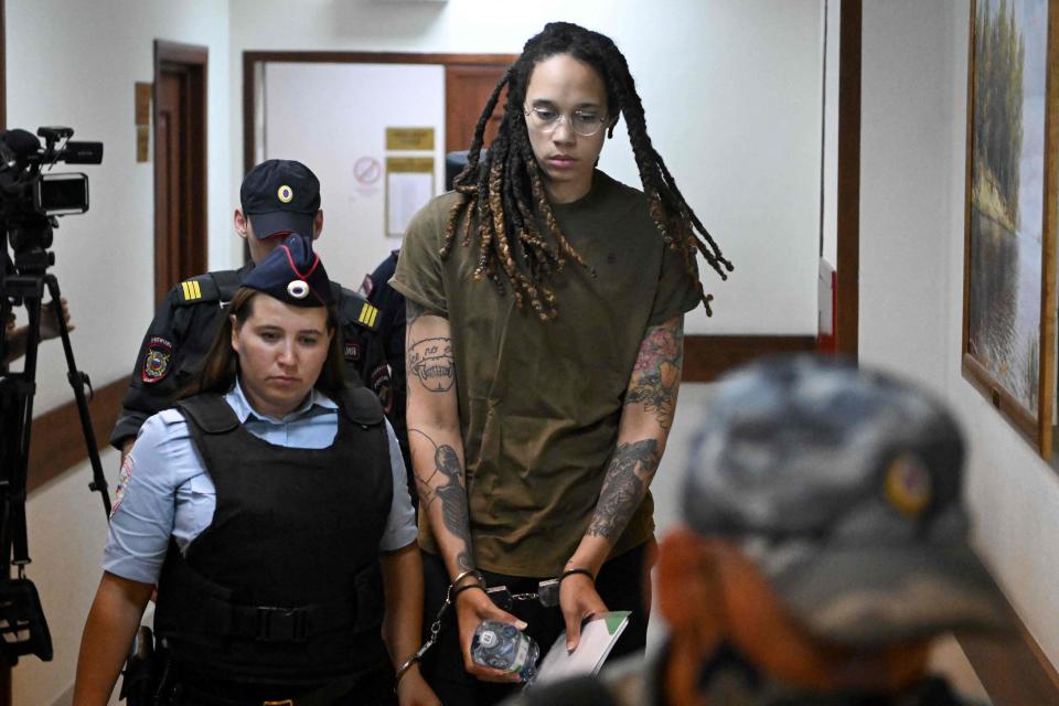 Brittney Griner is escorted by police for her trial for cannabis possession in Khimki, outside Moscow on Aug. 2, 2022.