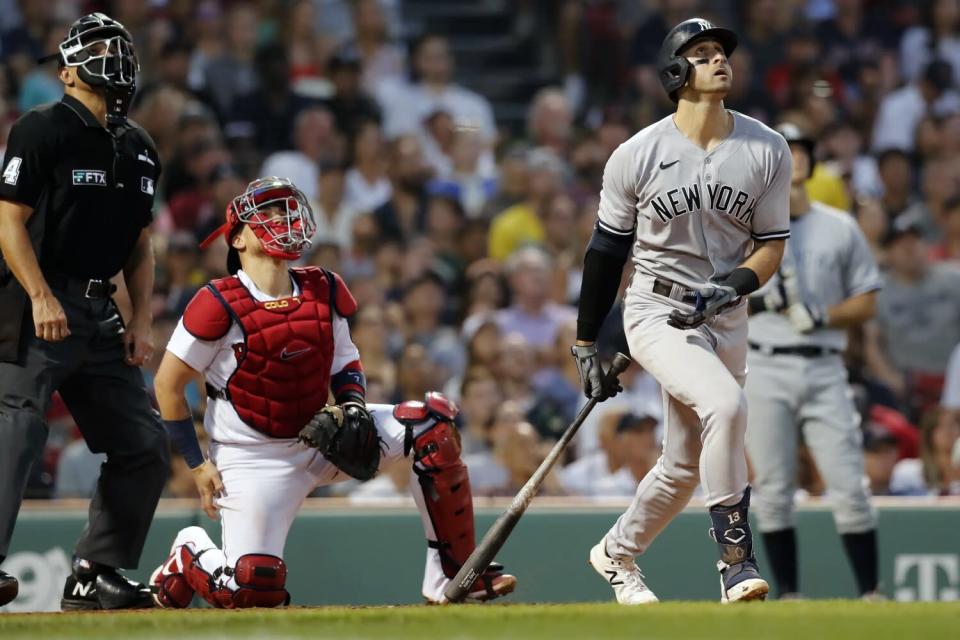 Joey Gallo watches his triple to right field in front of Boston Red Sox's Christian Vazquez.