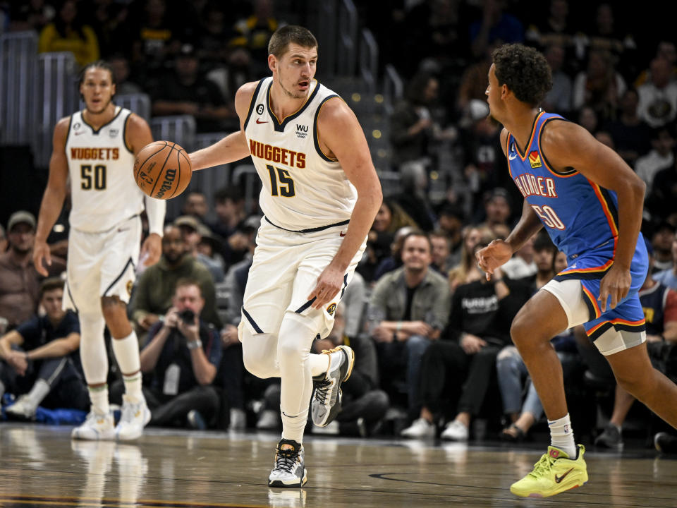 DENVER, CO - OCTOBER 3: Nikola Jokic (15) of the Denver Nuggets handles the ball in transition as Jeremiah Robinson-Earl (50) of the Oklahoma City Thunder defends during the first quarter on Monday, October 3, 2022. (Photo by AAron Ontiveroz/MediaNews Group/The Denver Post via Getty Images)