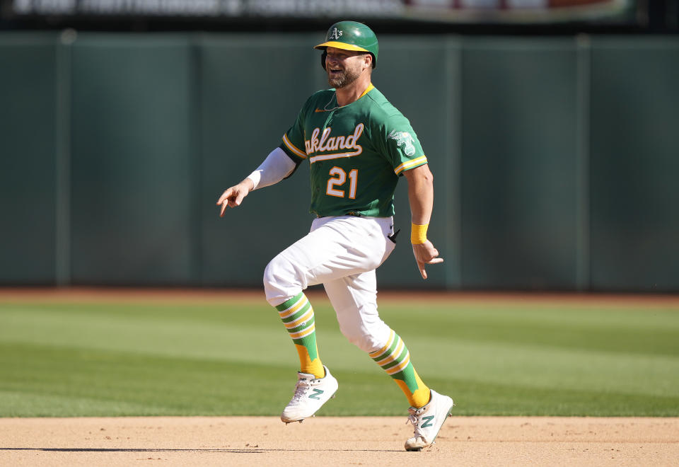 OAKLAND, CALIFORNIA - OCTOBER 05: Stephen Vogt #21 of the Oakland Athletics celebrates while trotting around the bases after hitting a solo home run against the Los Angeles Angels in the bottom of the seventh inning of the game at RingCentral Coliseum on October 05, 2022 in Oakland, California. (Photo by Thearon W. Henderson/Getty Images)
