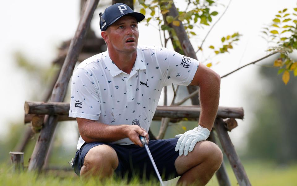 Bryson DeChambeau studies the line during the first round of the LIV Golf Invitational Bangkok golf tournament - SHUTTERSTOCK