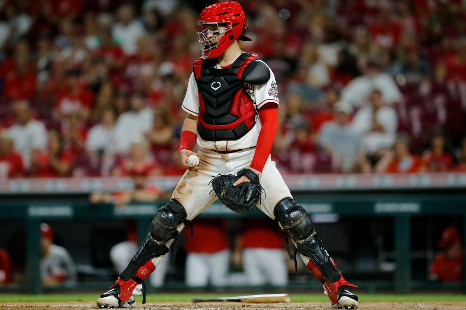 Reds catcher Michael Papierski stands over the plate after Baltimore Orioles second baseman Rougned Odor, not pictured, hit a double in the Reds' loss to the Orioles on July 29.