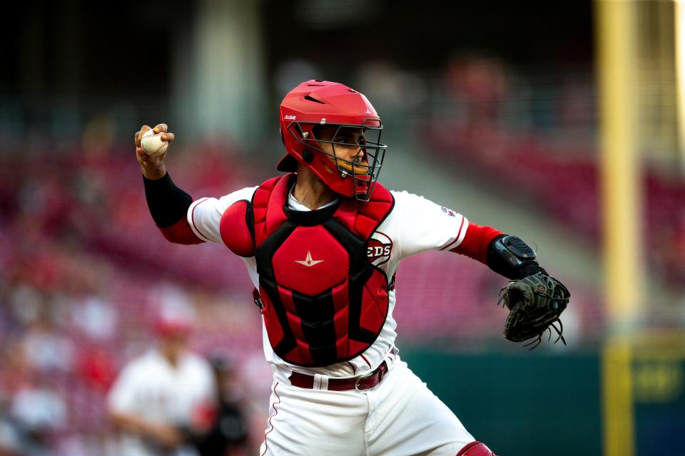 Reds catcher Aramis Garcia throws to first after a bunt during a game between the Reds and Dodgers on June 21.