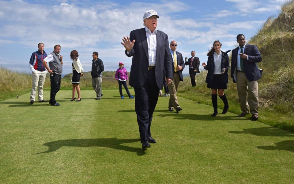 Donald Trump in Aberdeen/The Trump International Links in Balmedie has been mired in controversy since before it was opened in 2012 - GETTY IMAGES/JEFF J MITCHELL