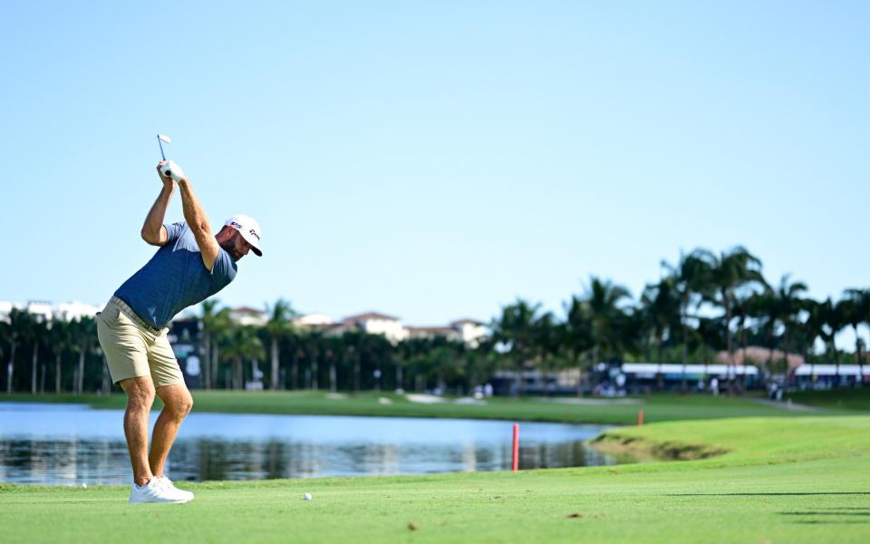 Team Captain Dustin Johnson of 4 Aces GC plays a shot on the eighth hole during a pro-am prior - GETTY IMAGES