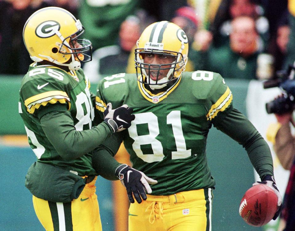 Green Bay Packers special teams member Tyrone Davis (81) is congratulated by Terry Mickens after recovering a Green Bay punt at the goalline for a touchdown in the first quarter against the Buffalo Bills at Lambeau Field in Green Bay, Wisconsin December 20. SPORT NFL