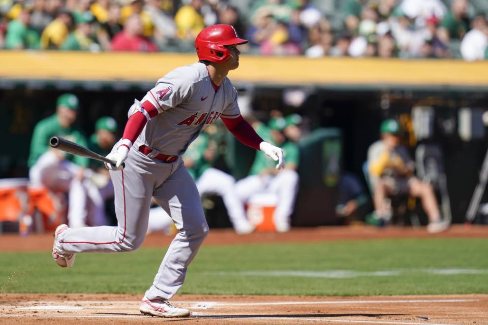 Angels' Shohei Ohtani watches his single against the Oakland Athletics.