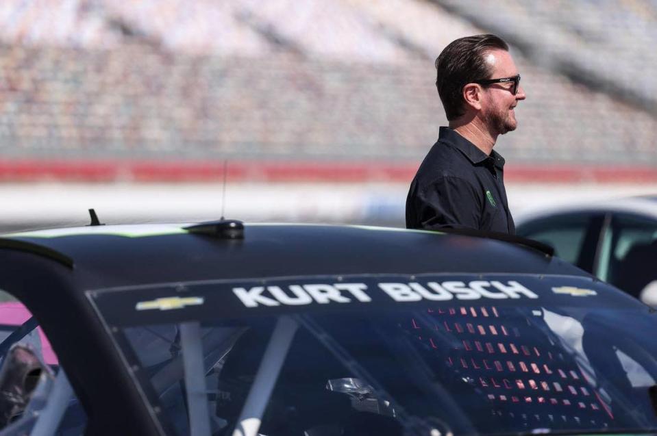 Kurt Busch stands by his car during the Paint Pit Wall Pink event at the Charlotte Motor Speedway in Charlotte, N.C., on Tuesday, September 28, 2021.